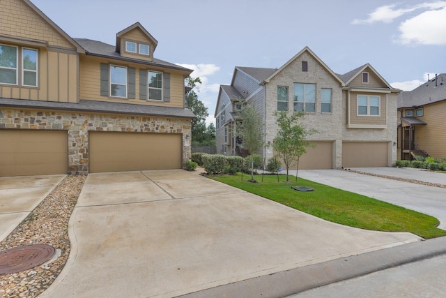 162 Cheswood Forest Pl, Montgomery, TX 77316 - view of front of home with a garage, driveway, stone siding, and board and batten siding