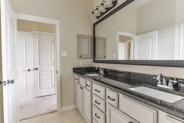 162 Cheswood Forest Pl, Montgomery, TX 77316 - full bathroom with double vanity, tile patterned flooring, and baseboards