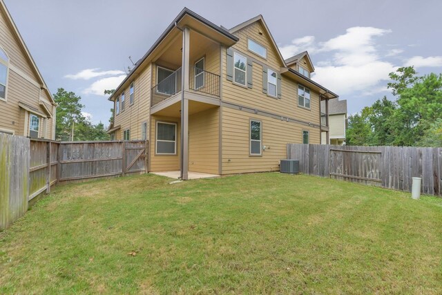 162 Cheswood Forest Pl, Montgomery, TX 77316 - rear view of house with a balcony and central AC unit