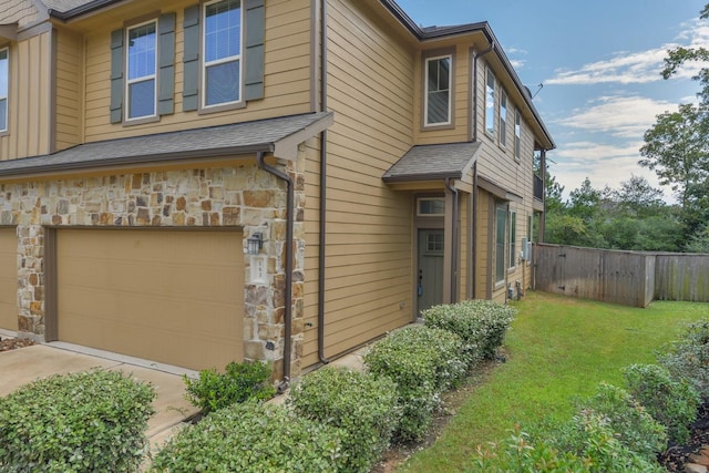 162 Cheswood Forest Pl, Montgomery, TX 77316 - view of home's exterior with a garage, stone siding, and driveway