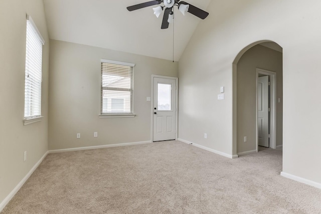 162 Cheswood Forest Pl, Montgomery, TX 77316 - spare room with light colored carpet, a ceiling fan, arched walkways, healthy amount of natural light, and high vaulted ceiling