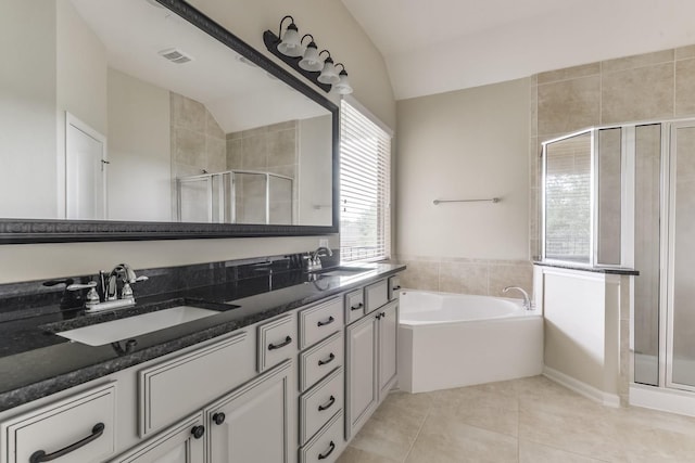 162 Cheswood Forest Pl, Montgomery, TX 77316 - full bath featuring lofted ceiling, a shower stall, double vanity, a bath, and tile patterned flooring