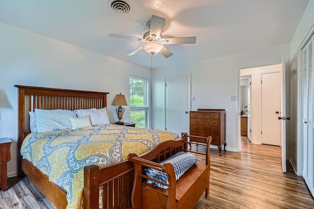 131 Park Dr, Point Blank, TX 77364 - bedroom with wood finished floors, a closet, baseboards, and ceiling fan