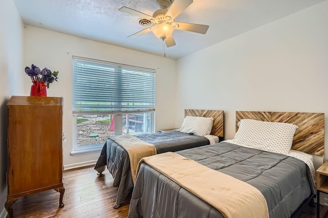 131 Park Dr, Point Blank, TX 77364 - bedroom featuring wood-type flooring, baseboards, and ceiling fan