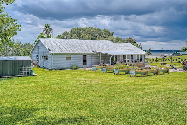131 Park Dr, Point Blank, TX 77364 - back of house featuring a garden, metal roof, and an outdoor structure
