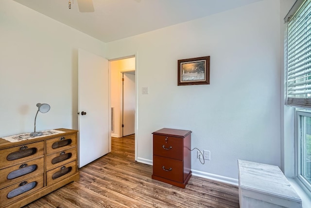 131 Park Dr, Point Blank, TX 77364 - bedroom featuring wood finished floors, baseboards, and a ceiling fan