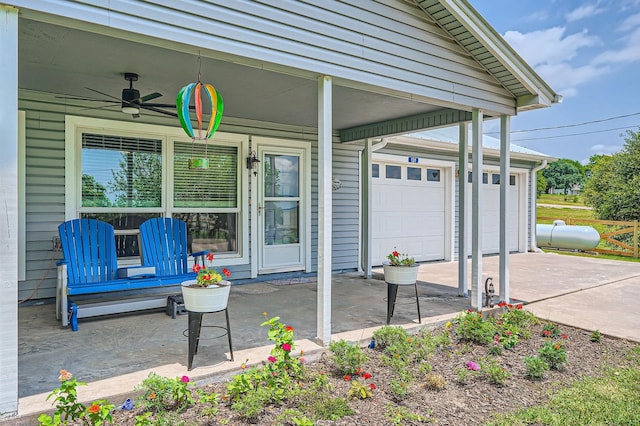 131 Park Dr, Point Blank, TX 77364 - covered porch featuring a garage, a ceiling fan, and concrete driveway