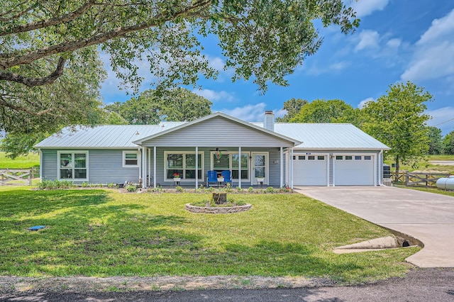 131 Park Dr, Point Blank, TX 77364 - single story home with a garage, concrete driveway, metal roof, and a chimney