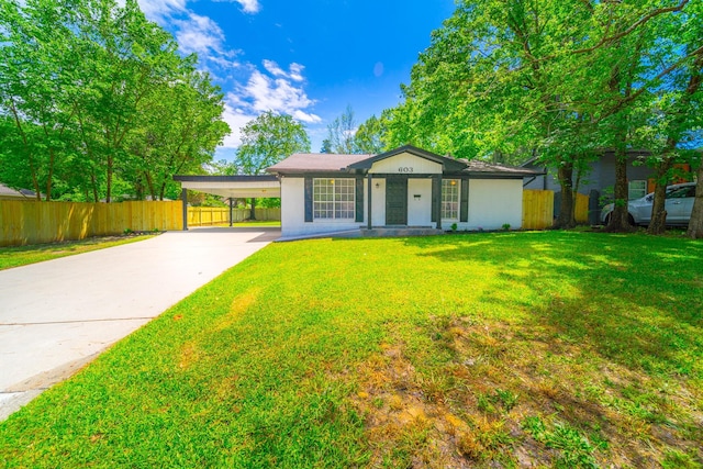 603 W Dallas St, Conroe, TX 77301 - ranch-style house featuring driveway and an attached carport