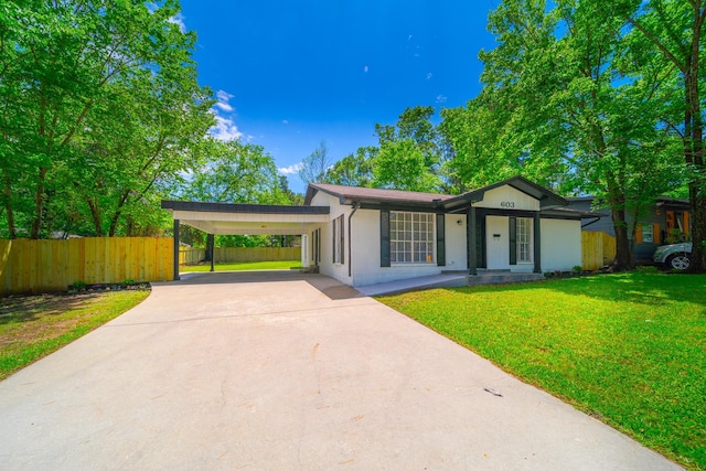 603 W Dallas St, Conroe, TX 77301 - ranch-style home featuring driveway and an attached carport