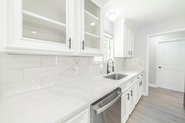 603 W Dallas St, Conroe, TX 77301 - kitchen with a sink, dishwasher, glass insert cabinets, light stone counters, and white cabinets