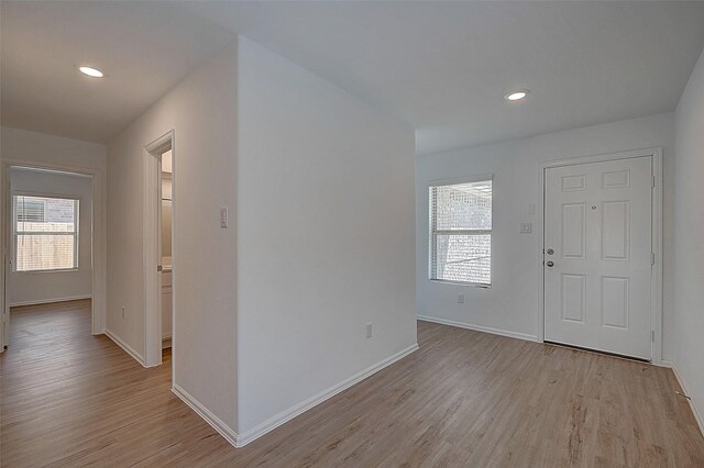 19915 Epirus Shores Dr, Hockley, TX 77447 - foyer with light wood finished floors, healthy amount of natural light, baseboards, and recessed lighting