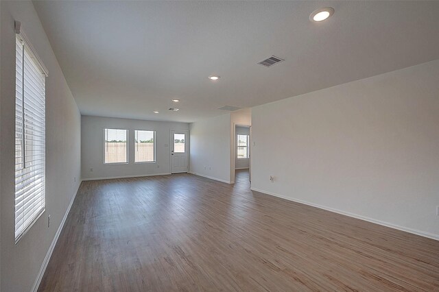 19915 Epirus Shores Dr, Hockley, TX 77447 - unfurnished room with baseboards, wood finished floors, and recessed lighting