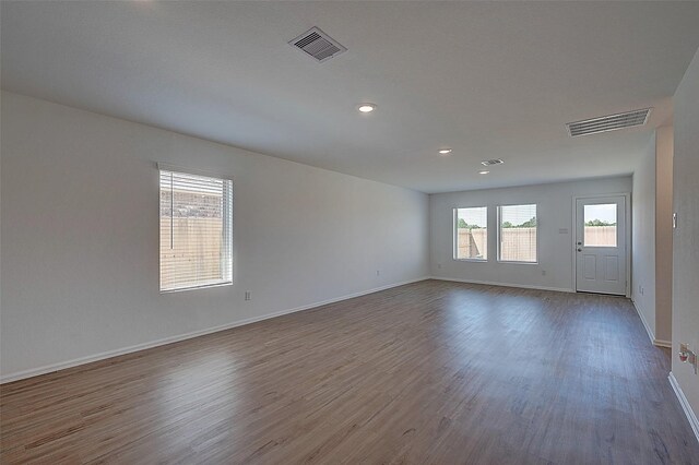 19915 Epirus Shores Dr, Hockley, TX 77447 - unfurnished room featuring wood finished floors, baseboards, and recessed lighting