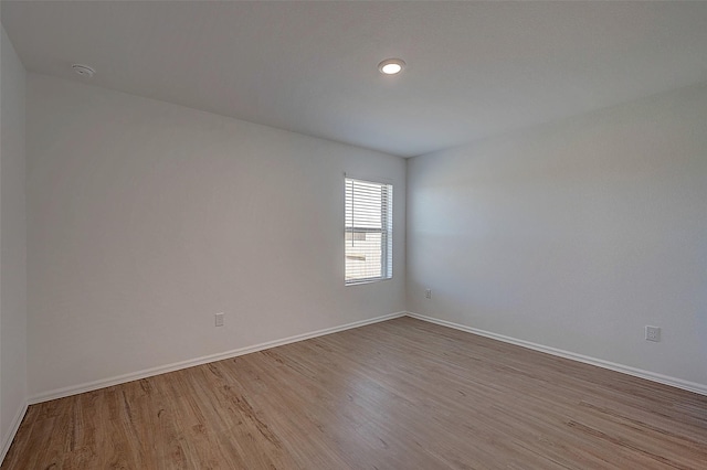 19915 Epirus Shores Dr, Hockley, TX 77447 - empty room with wood finished floors, baseboards, a smoke detector, and recessed lighting