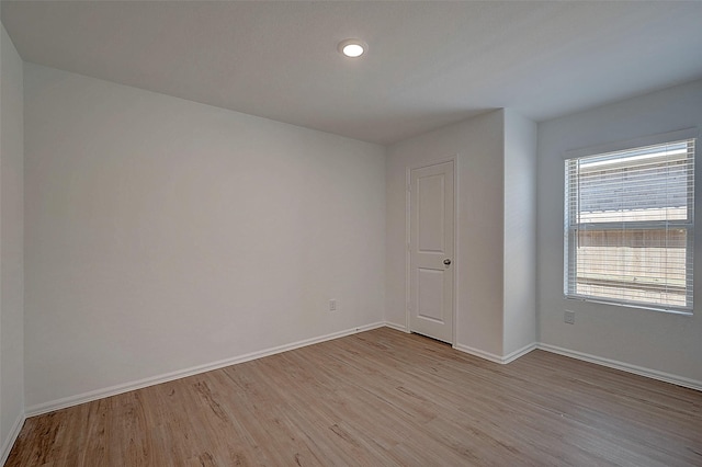 19915 Epirus Shores Dr, Hockley, TX 77447 - unfurnished room featuring light wood-style floors, baseboards, and recessed lighting