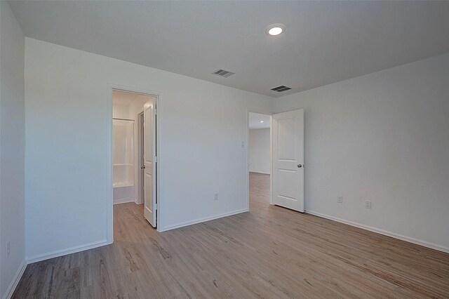 19915 Epirus Shores Dr, Hockley, TX 77447 - unfurnished bedroom featuring light wood-type flooring, baseboards, and recessed lighting