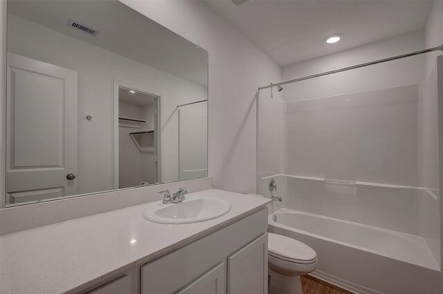 19915 Epirus Shores Dr, Hockley, TX 77447 - full bath featuring vanity, bathtub / shower combination, toilet, wood finished floors, and recessed lighting
