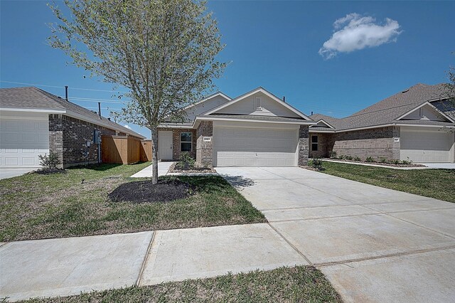 19915 Epirus Shores Dr, Hockley, TX 77447 - ranch-style house with driveway, a garage, and brick siding