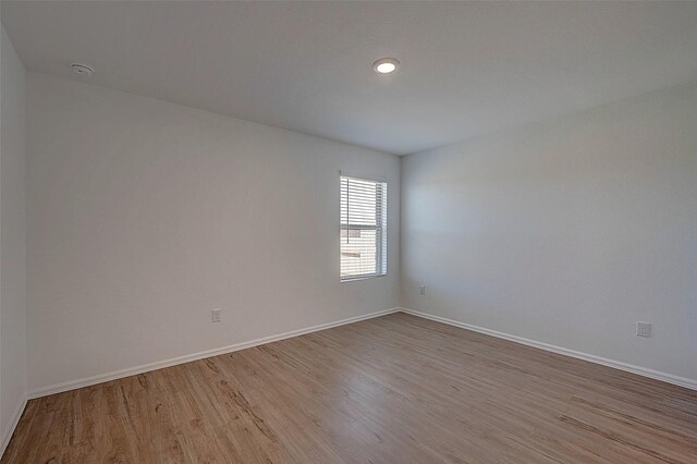 19915 Epirus Shores Dr, Hockley, TX 77447 - unfurnished room with wood finished floors, baseboards, a smoke detector, and recessed lighting