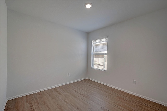 19915 Epirus Shores Dr, Hockley, TX 77447 - empty room featuring wood finished floors and baseboards