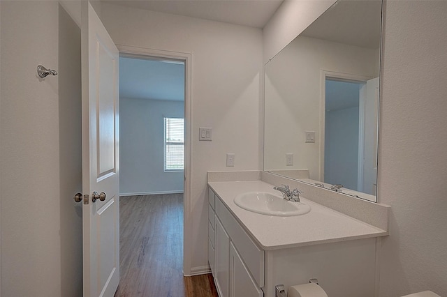 19915 Epirus Shores Dr, Hockley, TX 77447 - bathroom featuring wood finished floors, vanity, and baseboards