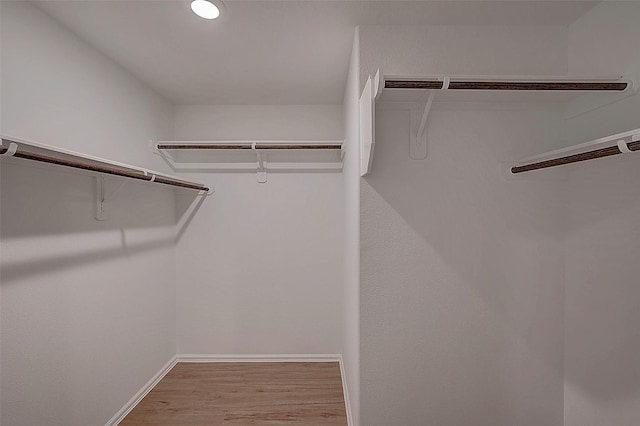 19915 Epirus Shores Dr, Hockley, TX 77447 - walk in closet featuring wood finished floors