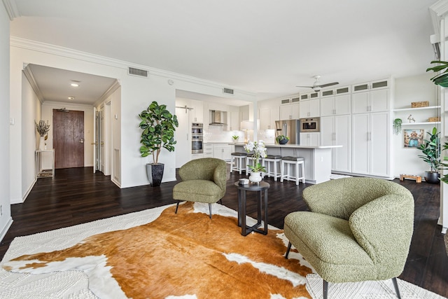651 Bering Dr Unit 906, Houston, TX 77057 - living area with a ceiling fan, wood finished floors, baseboards, and crown molding