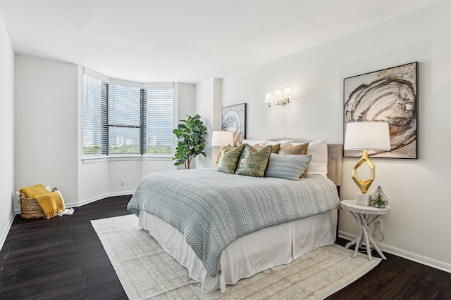 651 Bering Dr Unit 906, Houston, TX 77057 - bedroom featuring baseboards and wood finished floors