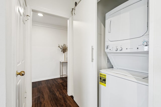 651 Bering Dr Unit 906, Houston, TX 77057 - laundry room featuring estacked washer and dryer, dark wood-style floors, and recessed lighting