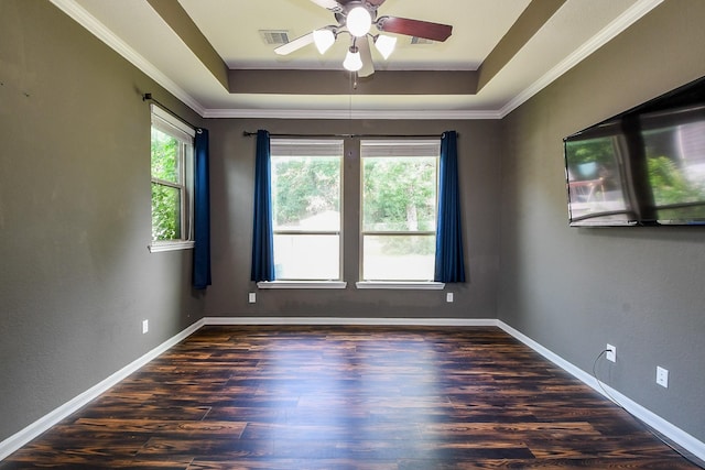 3544 Woods Estates Dr, Conroe, TX 77304 - spare room featuring ceiling fan, a raised ceiling, wood finished floors, baseboards, and ornamental molding
