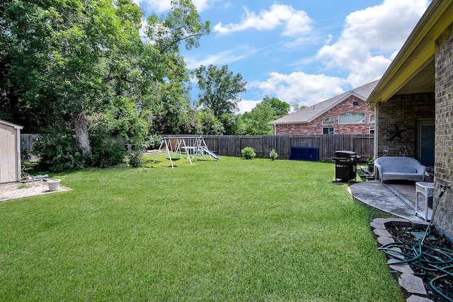 3544 Woods Estates Dr, Conroe, TX 77304 - view of yard featuring a playground and a patio area