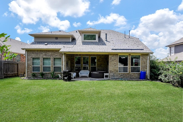 3544 Woods Estates Dr, Conroe, TX 77304 - rear view of house with brick siding, a patio area, a jacuzzi, and a shingled roof