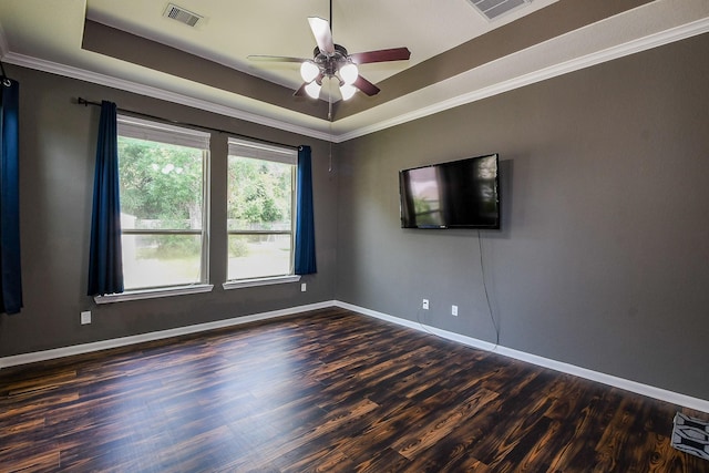 3544 Woods Estates Dr, Conroe, TX 77304 - spare room featuring a raised ceiling, wood finished floors, a ceiling fan, baseboards, and ornamental molding