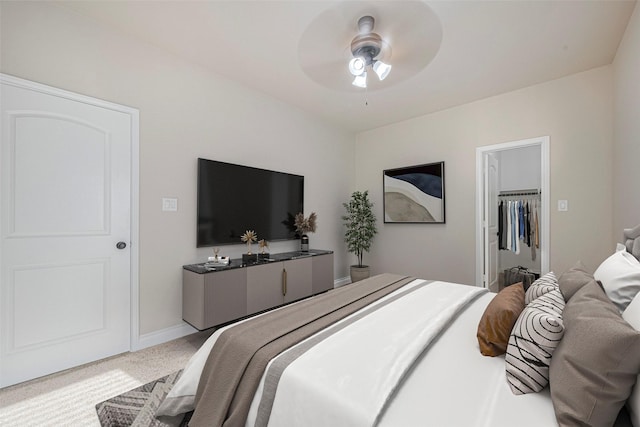 3519 Brampton Island Dr, Katy, TX 77494 - carpeted bedroom featuring baseboards, a ceiling fan, and a spacious closet