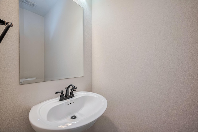 3519 Brampton Island Dr, Katy, TX 77494 - bathroom featuring a sink and a textured wall