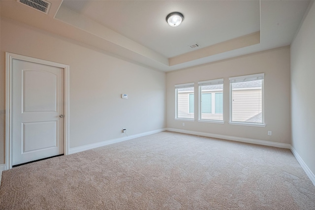 3519 Brampton Island Dr, Katy, TX 77494 - empty room featuring carpet floors, a tray ceiling, and baseboards