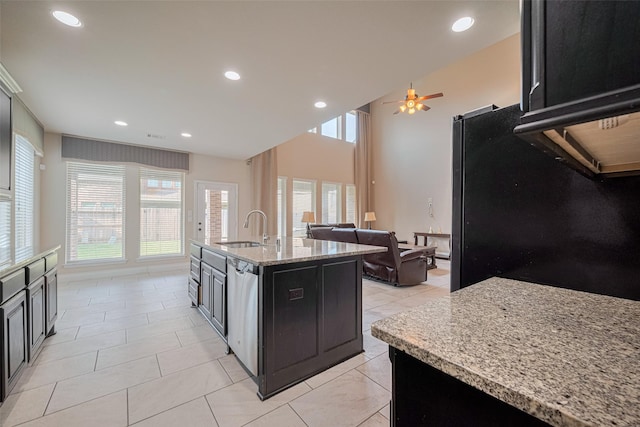 3519 Brampton Island Dr, Katy, TX 77494 - kitchen featuring a sink, dishwasher, ceiling fan, light stone countertops, and freestanding refrigerator