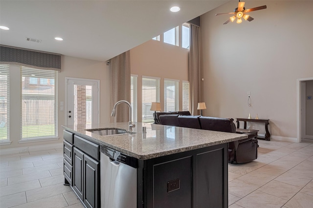 3519 Brampton Island Dr, Katy, TX 77494 - kitchen featuring dishwasher, a sink, dark cabinetry, light tile patterned floors, and recessed lighting