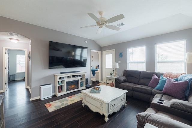 2238 Sterling Oaks Dr, Rosharon, TX 77583 - living area featuring ceiling fan, dark wood-style floors, lofted ceiling, a glass covered fireplace, and baseboards