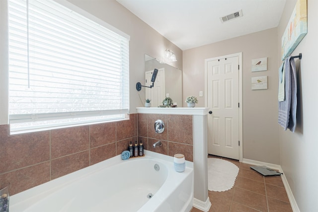 2238 Sterling Oaks Dr, Rosharon, TX 77583 - full bath featuring a garden tub, tile patterned floors, and baseboards
