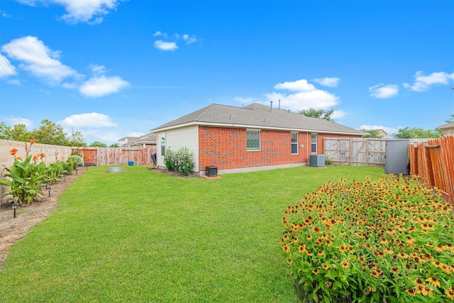 2238 Sterling Oaks Dr, Rosharon, TX 77583 - rear view of property featuring brick siding and cooling unit