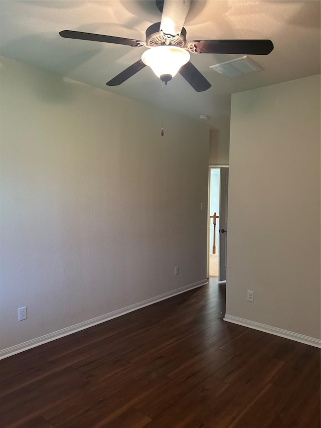 6015 Biltmore Ct, Rosenberg, TX 77471 - spare room featuring dark wood-style floors, ceiling fan, and baseboards
