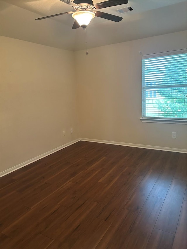 6015 Biltmore Ct, Rosenberg, TX 77471 - unfurnished room with dark wood finished floors, a ceiling fan, and baseboards