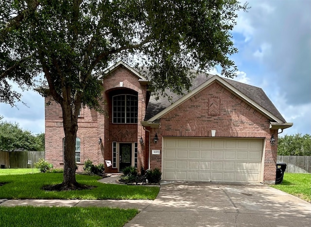 6015 Biltmore Ct, Rosenberg, TX 77471 - traditional-style house featuring concrete driveway, brick siding, and an attached garage
