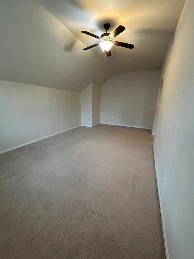 6015 Biltmore Ct, Rosenberg, TX 77471 - spare room featuring lofted ceiling, ceiling fan, light carpet, and baseboards