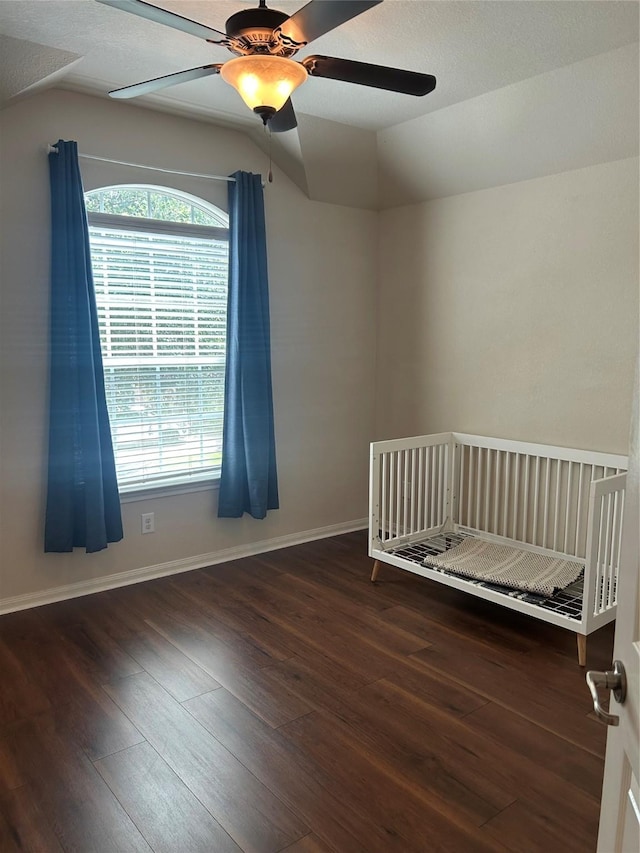 6015 Biltmore Ct, Rosenberg, TX 77471 - bedroom with wood-type flooring, lofted ceiling, ceiling fan, and baseboards