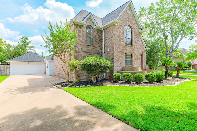 10402 Hondo Hill Rd, Houston, TX 77064 - traditional-style home with brick siding, a front yard, a garage, concrete driveway, and roof with shingles