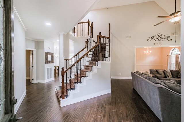 10402 Hondo Hill Rd, Houston, TX 77064 - staircase featuring wood finished floors, a ceiling fan, baseboards, a chandelier, and ornamental molding