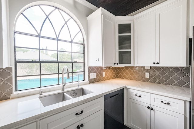 10402 Hondo Hill Rd, Houston, TX 77064 - kitchen with dishwashing machine, a sink, glass insert cabinets, white cabinetry, and backsplash